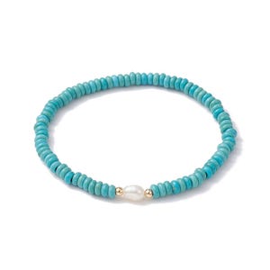 May include: A turquoise beaded bracelet with a single white pearl accent.