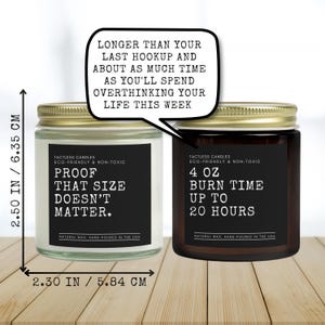 a couple of jars of candles sitting on top of a wooden table