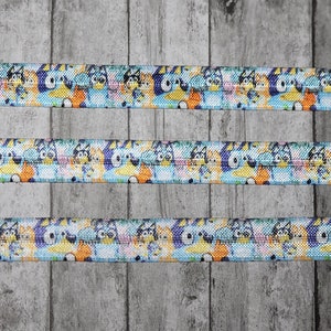 Inspired Cartoon Dog That's Blue Collage with Friends Fold Over Elastic, 5/8"