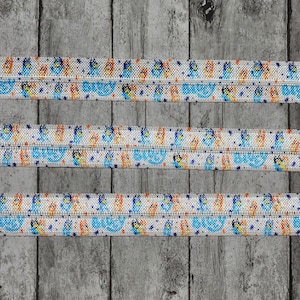 Inspired Cartoon Dog That's Blue with Polka Dots Fold Over Elastic, 5/8"