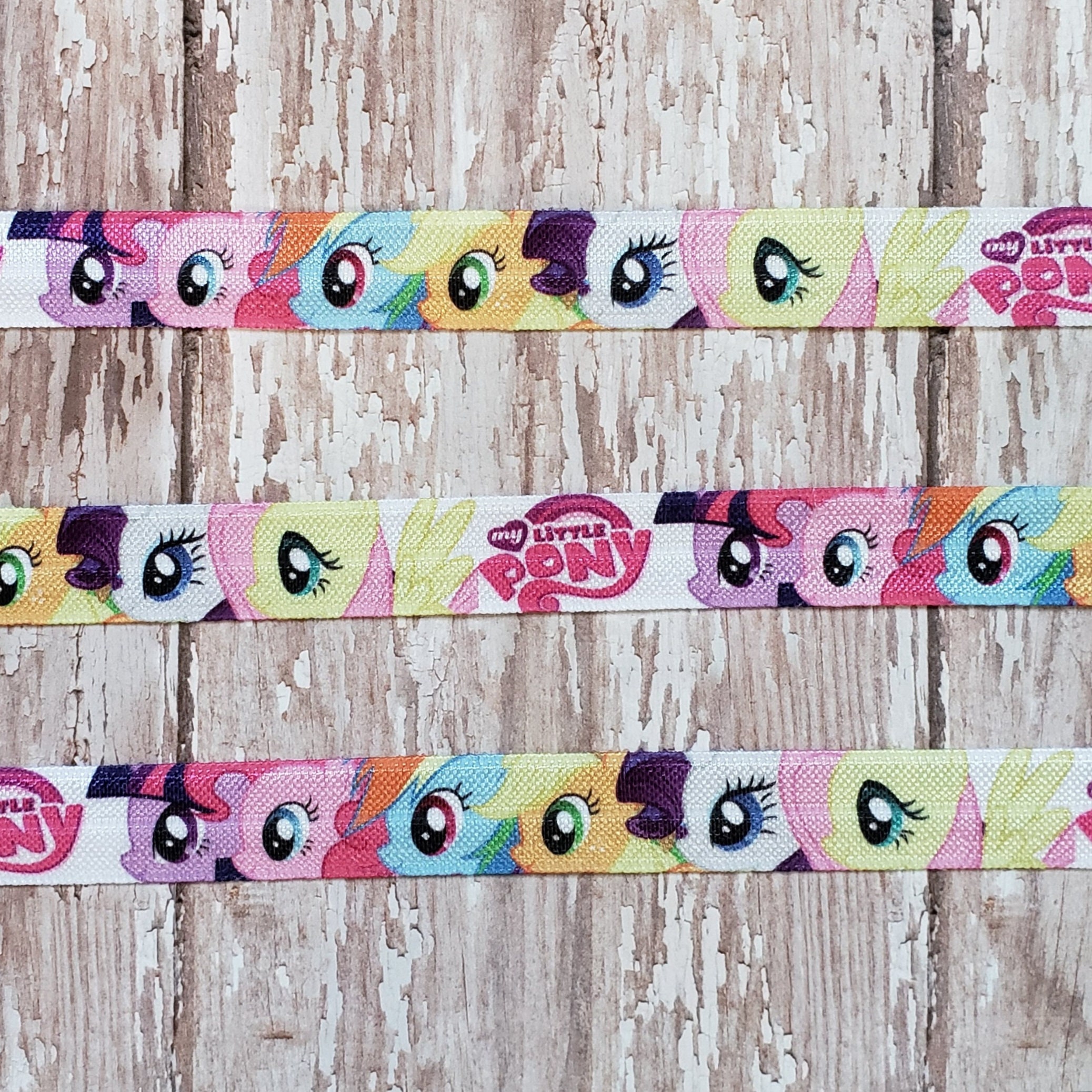 Inspired Small Pony Printed on White Fold Over Elastic, 5/8"