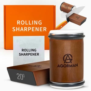 May include: A rolling knife sharpener set featuring a cylindrical wooden sharpener with the AGORMAN logo, a wooden magnetic base marked with 20 degrees, and an orange box labeled ROLLING SHARPENER. The set includes a manual with the same text.