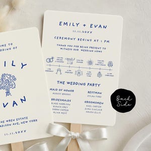 May include: Wedding fan with a cream background and navy blue text. The fan includes the names "Emily + Evan", wedding date, ceremony details, and a list of the wedding party. A white ribbon is tied at the base of the fan.