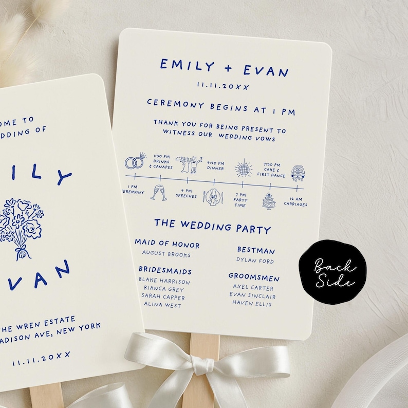 May include: Wedding fan with a cream background and navy blue text. The fan includes the names "Emily + Evan", wedding date, ceremony details, and a list of the wedding party. A white ribbon is tied at the base of the fan.