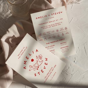May include: Two off-white wedding invitation cards with red text and line art illustrations. One card features the names Amelia and Steven with a drawing of a couple, while the other displays a wedding timeline, ceremony details, and the wedding party list.