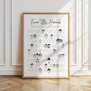 May include: A framed print with the names "Evan & Hannah" and the text "Doodle Yourself & Sign Your Name." The print features a grid of blank circles with doodle faces, ready for personalization. The frame is a warm gold color.