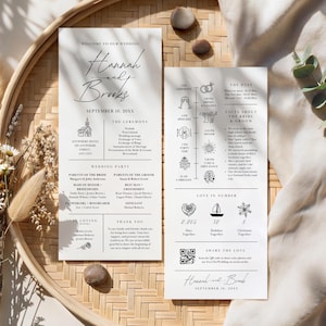 May include: Two white rectangular wedding program cards with black text and line art illustrations. The left card lists the ceremony schedule and wedding party. The right card features a timeline, facts about the couple, love in numbers, and a QR code.