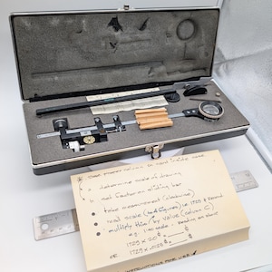 May include: A set of three ceramic mugs with a speckled, matte finish. The mugs are in shades of cream, light gray, and dark gray. Each mug has a simple, minimalist design, perfect for coffee or tea.