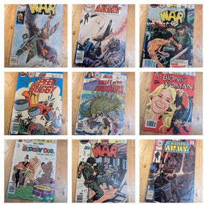 May include: A selection of vintage comic books with titles such as "War," "The Bionic Woman," and "Speed Buggy." The comic covers showcase action-packed scenes and colourful illustrations, reflecting classic comic book art styles. The comics are from the 1970s.