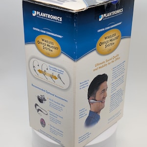 May include: A Plantronics Wireless Office Headset System C550 box. The box is white and blue with the Plantronics logo and the words "Crystal Clear Conversations." The box features images of the headset and its accessories.