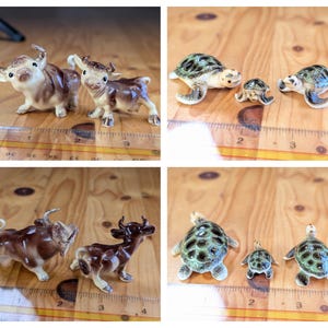 May include: Four images of ceramic animal figurines. Two images show pairs of brown and tan cows. The other two images show sets of three turtles with green and black shells. The figurines are on a wooden surface.