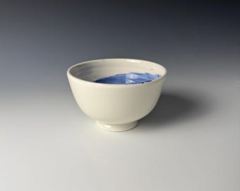 Porcelain rice bowl with blue brushed decor on inside