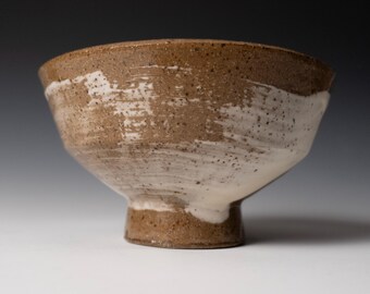 Stoneware bowl with white slip and elegant foot