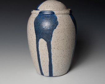 Small urn with white speckle and blue decoration