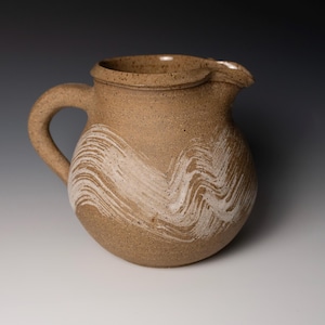 Hakeme dekorerad stengodskanna