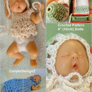 May include: Crochet pattern for 4" (10cm) dolls. The image shows a doll wearing a white crocheted dress and hat, a doll wearing a blue crocheted dress and hat, and a doll wearing a white crocheted dress and hat in a red wagon.