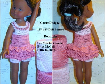 May include: A crochet doll dress with a pink and white color scheme. The dress has a ruffled skirt and is designed for 13-14 inch dolls. The dress is shown on a doll with brown skin and black hair. The text "CarussDesignz 13"-14" Doll Pattern Dolls Like Les Cheries Corelle Betsy McCall Little Darling" is visible in the image.