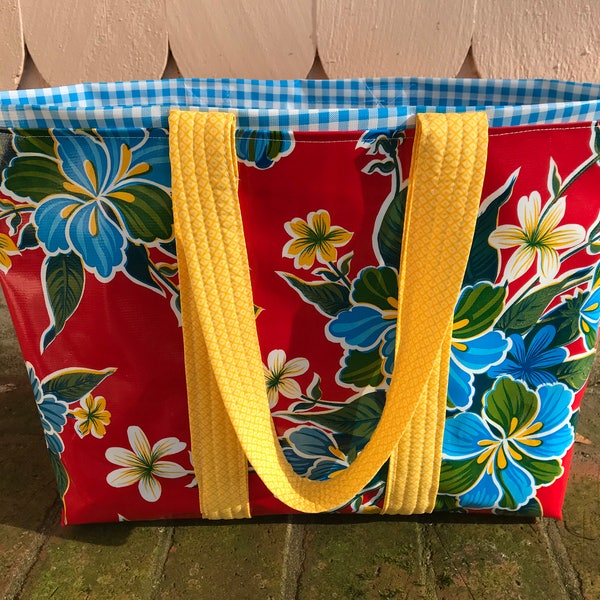 hibiscus patterned floral oilcloth tote bag on tomato red