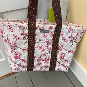Large cherry blossom reversible  floral oilcloth tote bag on muted gray