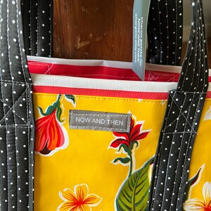 hibiscus patterned floral oilcloth tote bag on egg yolk yellow image 2