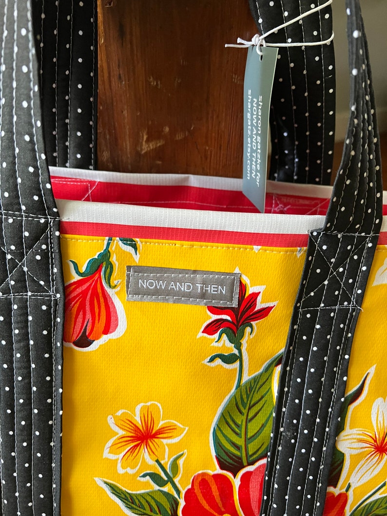 hibiscus patterned floral oilcloth tote bag on egg yolk yellow image 2