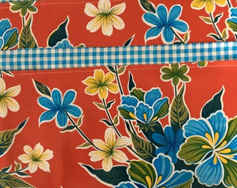 Red floral funk---Reversible oilcloth placemats in an hibiscus print and gingham