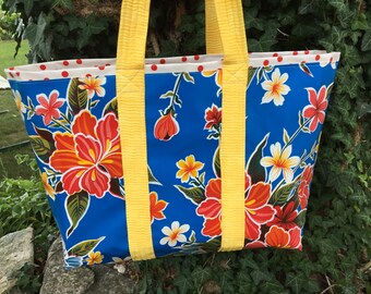 hibiscus patterned floral oilcloth tote bag on royal blue