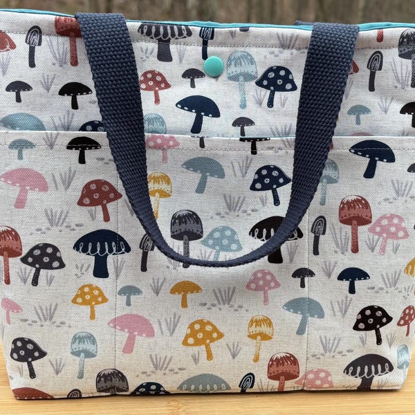 Brightly colored 7 pocketed canvas mushroom tote bag.
