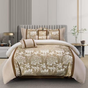 May include: A beige and brown floral patterned duvet cover with a matching set of pillowcases and decorative pillows. The bedding set features a luxurious, embossed design.