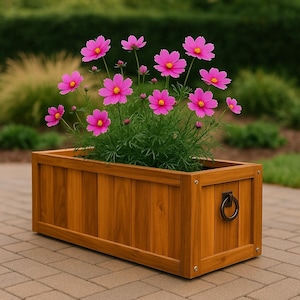 May include: A rectangular wooden planter box filled with vibrant pink cosmos flowers. The box is made of vertical wooden planks and features a dark metal ring handle on the side. The flowers have yellow centers and green foliage.