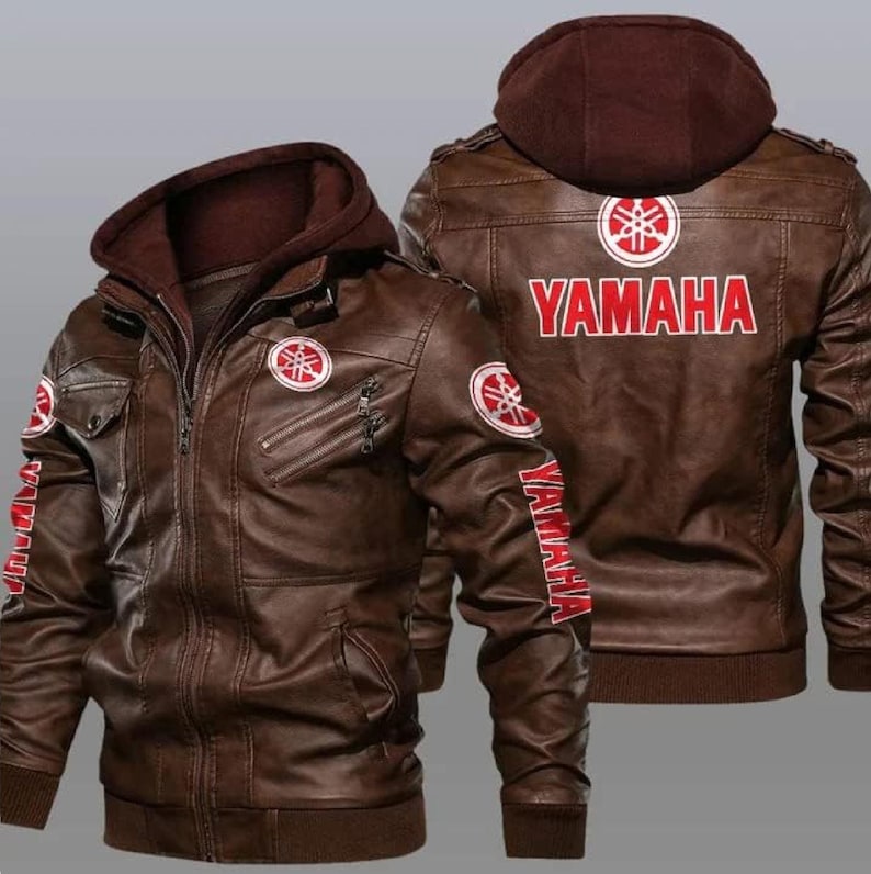May include: A brown leather jacket with a Yamaha logo on the back and sleeves. The jacket has a zipper closure and a hood.