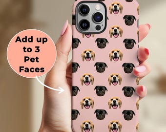 May include: A pink iPhone case with a repeating pattern of dog faces. The case has a cutout for the camera lens and a black border around the edges. The text "Add up to 3 Pet Faces" is visible in the image.