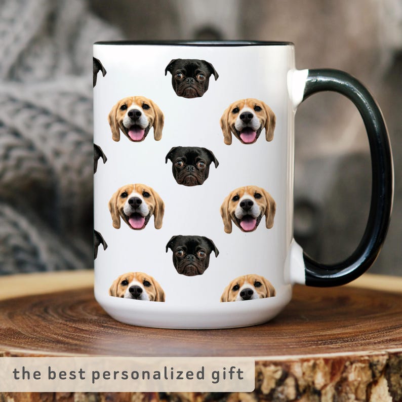 May include: White ceramic mug with a black rim and handle. The mug features a repeating pattern of dog faces, including pugs and beagles.
