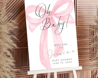 May include: A pink watercolor bow with the text "Oh Baby!" and "Welcome to Jessica's Baby Shower June 15, 2025" on a white background.