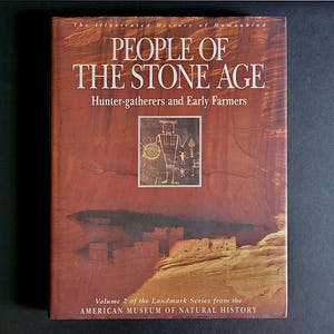 May include: A hardcover book titled People of the Stone Age: Hunter-gatherers and Early Farmers, Volume 2 of the Landmark Series from the American Museum of Natural History. The cover features a brown rock formation and a petroglyph illustration.