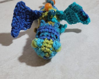 Handmade crocheted beaded dinosaur fidget