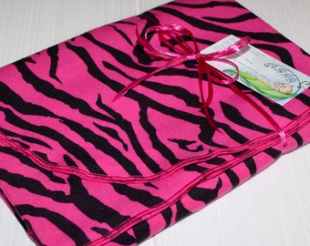 zebra blanket with pink trim