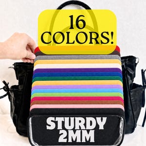 May include: A black bag organiser insert featuring 16 horizontal felt panels in various colours stacked vertically. The bottom section is black with the white text STURDY 2MM, and a yellow overlay at the top displays the text 16 COLORS!