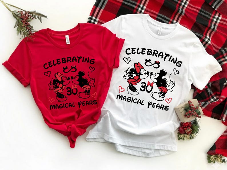 Close-up of a Disney inspired 30th anniversary shirt featuring Mickey and Minnie artwork surrounded by heart details and celebratory typography. The playful yet meaningful design captures three decades of love and is ideal for Disneyland anniversary vacations or romantic milestone events.
