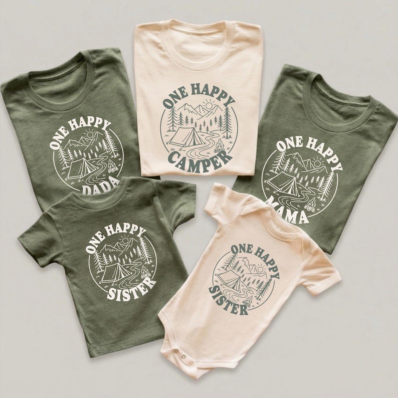 a collection of five t-shirts, each with a unique design and text, arranged in a row.
