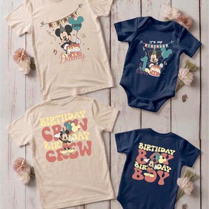 a collection of birthday-themed t-shirts and a baby onesie, all featuring the character Mickey Mouse.