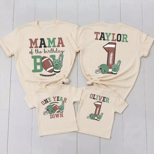 a set of three beige t-shirts with personalized text and graphics, likely intended for a family or group of friends.