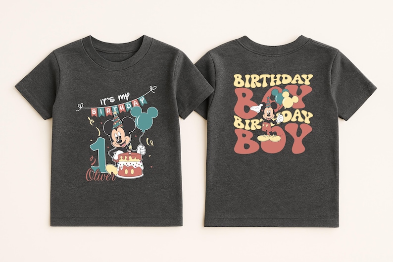 two black t-shirts with a Mickey Mouse design and text related to a birthday celebration.