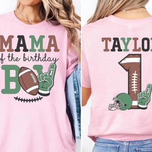 two different views of a pink t-shirt with a graphic design featuring a football and the text "MAMA of the birthday B1".