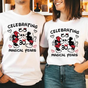 Front view of matching Disney Mickey Minnie anniversary sweatshirts with a bold 30 Magical Years design. The red and black artwork stands out clearly on the neutral fabric, creating a romantic and nostalgic look for couples celebrating thirty years of marriage at Disneyland or a Disney themed anniversary party.