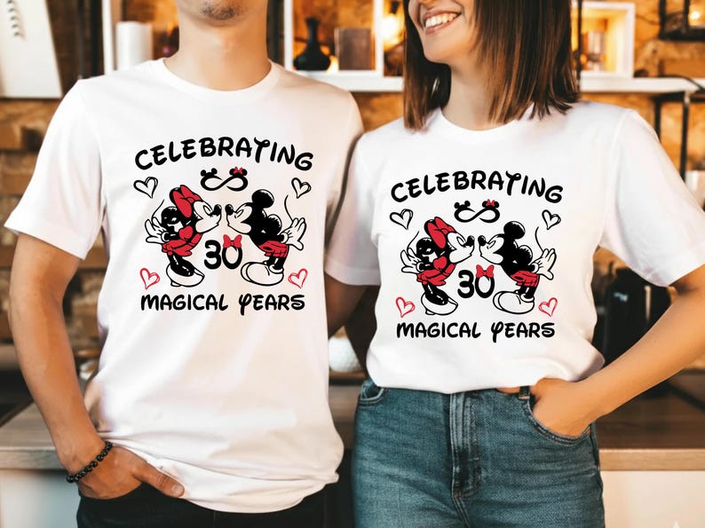 Front view of matching Disney Mickey Minnie anniversary sweatshirts with a bold 30 Magical Years design. The red and black artwork stands out clearly on the neutral fabric, creating a romantic and nostalgic look for couples celebrating thirty years of marriage at Disneyland or a Disney themed anniversary party.