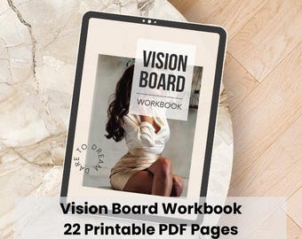 May include: A digital tablet displaying a Vision Board Workbook cover with the text VISION BOARD WORKBOOK and DARE TO DREAM. The screen shows a person with long dark hair wearing a white blouse and tan skirt, set against a neutral background.