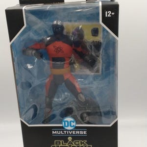 May include: A Black Adam Atom Smasher action figure in a clear plastic package. The figure is wearing a black and orange suit. The packaging includes the text "DC Multiverse" and "McFarlane Toys". The figure has 22 points of articulation.