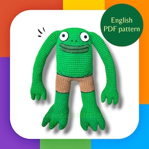 May include: A handmade green crochet frog doll with large eyes, a smiling mouth, and tan shorts. The doll has long arms and large feet. The image includes the text "English PDF pattern" on a green circle.