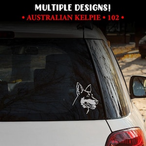 May include: A white vinyl decal of an Australian Kelpie dog head profile applied to the rear window of a white vehicle. The text MULTIPLE DESIGNS! and AUSTRALIAN KELPIE 102 is displayed in white and red at the top of the image.